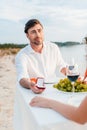 handsome man making propose with ring to woman in romantic date Royalty Free Stock Photo
