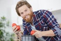 handsome man making sauce for pasta at home Royalty Free Stock Photo