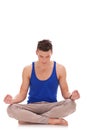 Handsome man meditating in lotus position Royalty Free Stock Photo