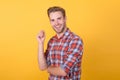 Handsome man model portrait. charismatic man wearing checkered shirt. guy in plaid shirt standing with arms crossed. his