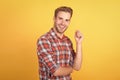 Handsome man model portrait. charismatic man wearing checkered shirt. guy in plaid shirt standing with arms crossed. his