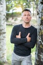 Handsome man. Outdoor male portrait. Single attractive mid-adult man posing in spring park