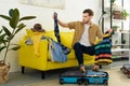 handsome man packing clothes into Royalty Free Stock Photo