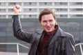 Handsome man pointing to modern building offices