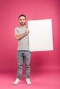 handsome man posing with blank board, isolated