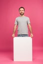 handsome man posing with empty board, isolated Royalty Free Stock Photo