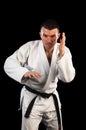 Handsome man practicing Brazilian jiu-jitsu (BJJ) Royalty Free Stock Photo