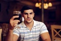 Handsome Man Raising Wine Glass in Toast Royalty Free Stock Photo