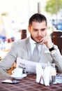 Handsome man reading newspaper Royalty Free Stock Photo