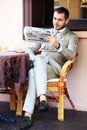 Handsome man reading newspaper Royalty Free Stock Photo