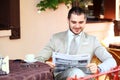 Handsome man reading newspaper Royalty Free Stock Photo