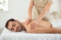 Handsome man receiving back massage Royalty Free Stock Photo