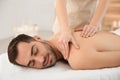 Handsome man receiving back massage Royalty Free Stock Photo