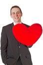Handsome man with red heart shaped pillow Royalty Free Stock Photo