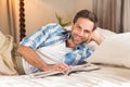 Handsome man relaxing on his bed Royalty Free Stock Photo