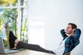 Handsome man relaxing on his desk chair Royalty Free Stock Photo