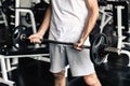 Handsome Man is Rowing Exercise With Bodybuilder Equipment in Fitness Club.,Portrait of Strong Man Doing Working Out Calories