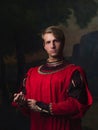 Handsome man in a Royal red doublet.