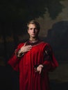 Handsome man in a Royal red doublet.