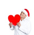A handsome man in santa's hat lost in romantic thoughts Royalty Free Stock Photo