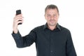 Handsome man selfie picture holding mobile cell phone in white background Royalty Free Stock Photo