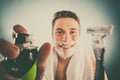 Handsome man with shaving cream foam can and razor Royalty Free Stock Photo