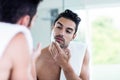 Handsome man shaving his beard Royalty Free Stock Photo