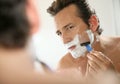 Handsome man shaving Royalty Free Stock Photo