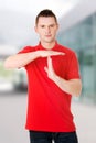 Handsome man showing time out sign Royalty Free Stock Photo