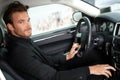 Handsome man sitting in car Royalty Free Stock Photo