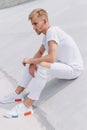 Handsome man sitting in the city on a white background Royalty Free Stock Photo