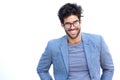 Handsome man smiling with glasses and blue blazer