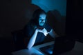 Handsome man is smocking cigarettes in front of his computer Royalty Free Stock Photo