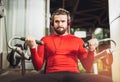 Handsome man in sportswear exercising at gym Royalty Free Stock Photo