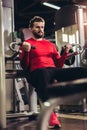 Handsome man in sportswear exercising at gym Royalty Free Stock Photo