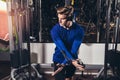 Handsome man in sportswear exercising at gym Royalty Free Stock Photo