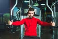 Handsome man in sportswear exercising at gym Royalty Free Stock Photo