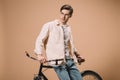 Handsome man standing near bike isolated Royalty Free Stock Photo