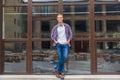 Handsome man standing outside of office building Royalty Free Stock Photo