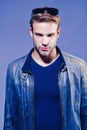 Handsome man - studio portrait. Close-up portrait of cheerful young man on gray background with copy space. Royalty Free Stock Photo