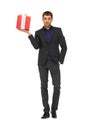 handsome man in suit with a gift box Royalty Free Stock Photo