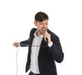 Handsome man in suit singing with microphone Royalty Free Stock Photo