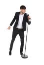 Handsome man in suit singing with microphone Royalty Free Stock Photo