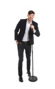 Handsome man in suit singing with microphone Royalty Free Stock Photo