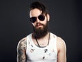 Handsome man in sunglasses. bearded hipster with tattoo Royalty Free Stock Photo