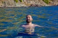 Handsome man swimming in the sea in summer Royalty Free Stock Photo