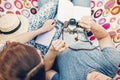 Handsome man taking picture of a beautiful brunette girl, hipster couple with old film camera making photographs on a hammock near Royalty Free Stock Photo