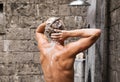 Man taking shower and washing hair