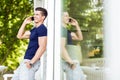 Handsome man talking on the phone outdoors Royalty Free Stock Photo