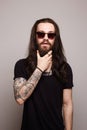 Handsome man with tattoo and sunglasses Royalty Free Stock Photo